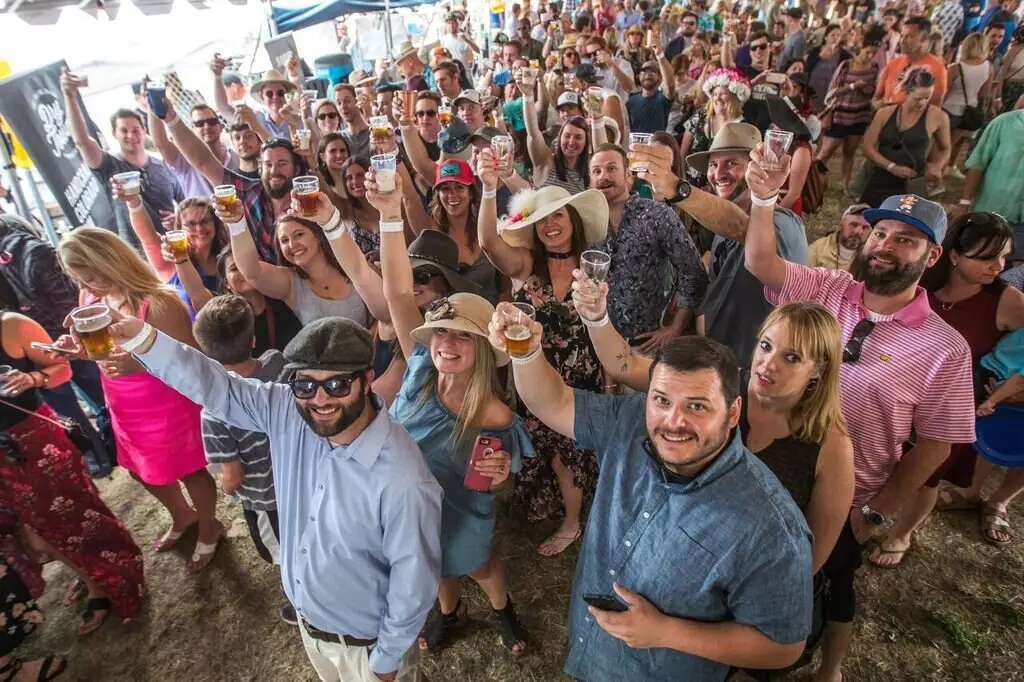 The crowd with arms up, facing the camera