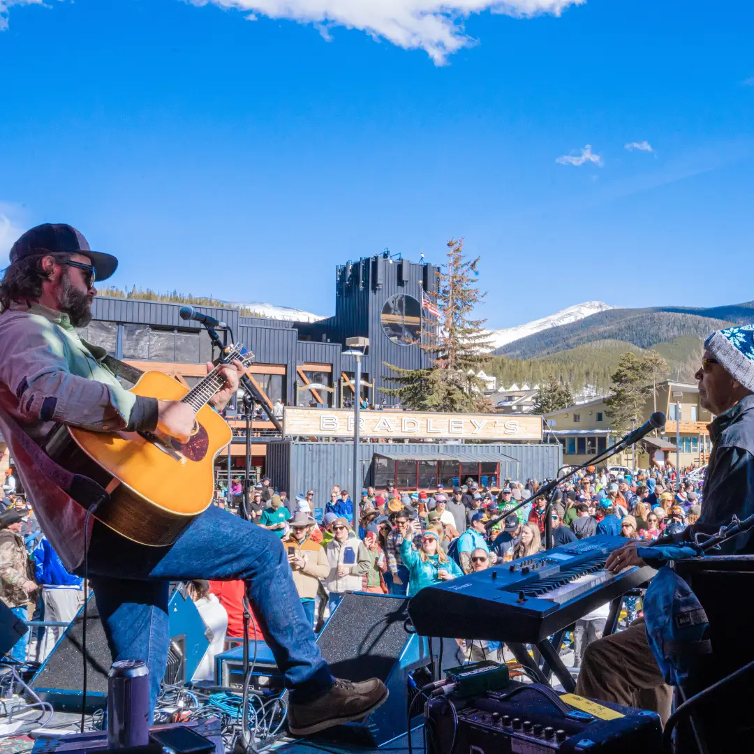 A guitarist on stage on Larimer Street