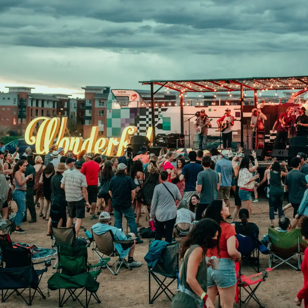 The crowd on Larimer Street beside the Wonderful sign