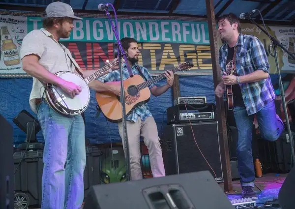 Andy Thorn on banjo under the Big Wonderful stage banner