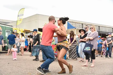 A couple dancing in the lot.
