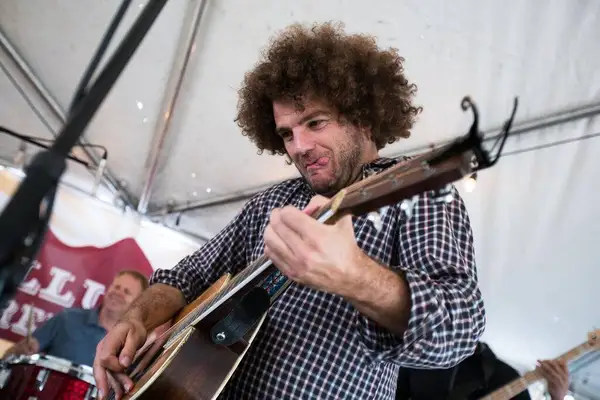 Rob Drabkin, curly hair flying, playing guitar
