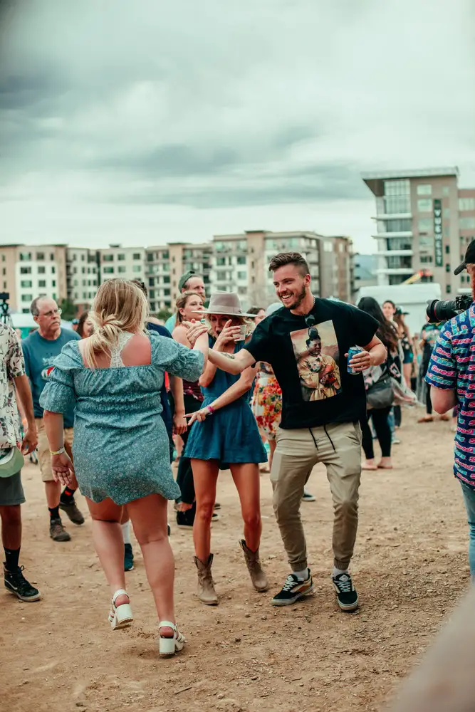 A couple dancing in the lot.